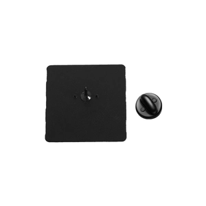 Detail view of the black matte metal cat brooch back with safety pins and rubber clutch
