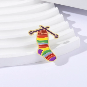 Creative rainbow knitted sock brooch with purple needles and golden metal finish