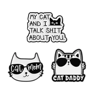 Funny black and white enamel cat brooches set with humorous Cat Mom and Dad quotes