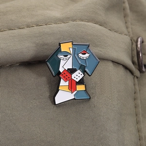 Macro detail of a cubist dog-shaped enamel brooch with colorful geometric patterns