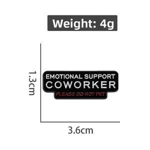 Detailed size view of black enamel pin with Emotional Support Coworker text, 1.3cm x 3.6cm