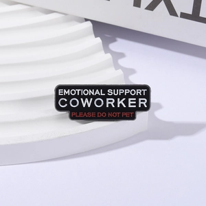 Black enamel pin with Emotional Support Coworker and Please Do Not Pet slogan