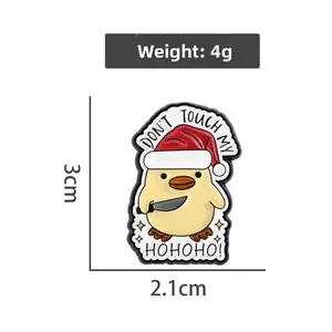 Detail view of funny Christmas duck enamel pin showing dimensions 3cm x 2.1cm and 4g weight