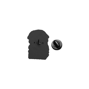 Detail view of the black enamel pin back with anti-slip texture and rubber clutch attachment