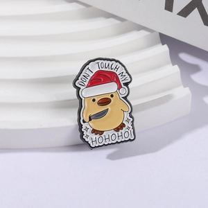 Cartoon duck enamel pin with Santa hat and knife featuring Don't Touch My Hohoho text