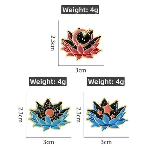 Detailed view of enamel lotus brooches with celestial moon and star patterns
