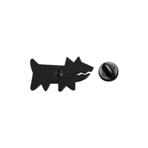 Detail view of the black dog enamel pin back with rubber clutch and metal needle fastener