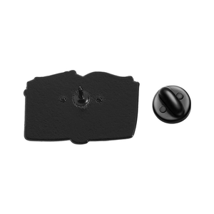 Black metal cartoon badge pin back with matching round rubber clutch fastener on white background