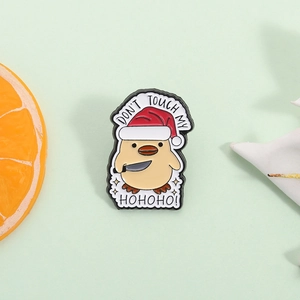 Funny Christmas duck enamel pin with 'Don't Touch My Hohoho' slogan and Santa hat