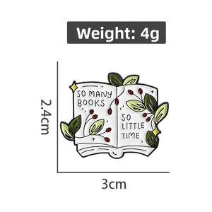 Detailed view of book enamel pin with green leaves and 3cm x 2.4cm dimensions