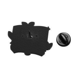 Detailed back view of a black enamel pin with metal clutch and secure rubber backing