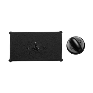 Detailed view of matte black brooch pin back base and rubber clutch for badges