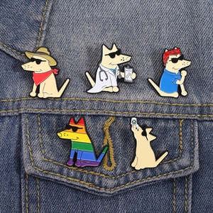 Detailed close-up of 5 enamel dog pins on denim jacket showing doctor and cowboy styles
