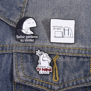 Detailed view of three funny enamel pins with Flork memes on a blue denim jacket