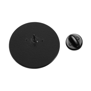 Detail view of the black round brooch backing with pin base and secure rubber clutch