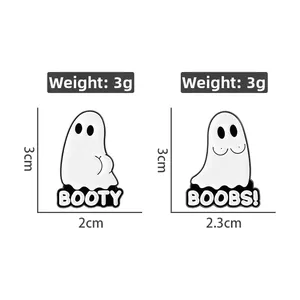Detail showing dimensions of funny ghost enamel pins with BOOTY and BOOBS lettering