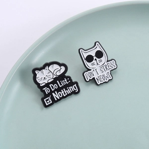 Funny cartoon cat enamel pins featuring black and white cats with humorous slogans