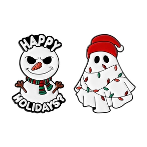 Christmas enamel pins set featuring a snowman with scarf and a ghost with holiday lights