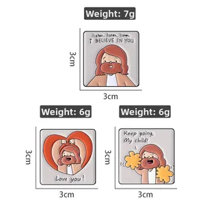 Detailed view of three cartoon Jesus square badges with inspirational quotes and dimensions