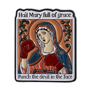 Enamel pin with boxing Virgin Mary and Hail Mary full of grace text on white background