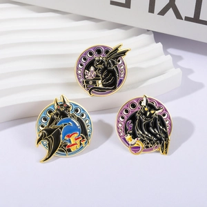 Three gothic fantasy enamel pins featuring a black cat, bat, and owl with gold outlines