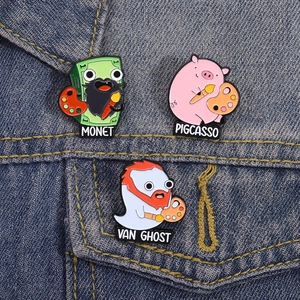 Close-up of Monet, Pigcasso, and Van Ghost enamel pins pinned on a blue denim jacket pocket