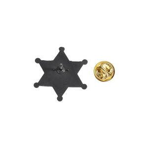 Detailed back view of a black metal star badge featuring a secure gold butterfly clasp