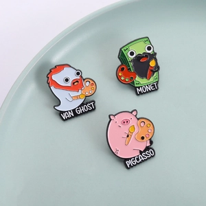 Whimsical enamel art badges featuring Van Ghost, Monet, and Pigcasso on a ceramic plate