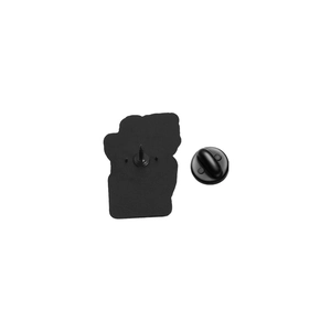 Detail of the black metal brooch back with secure rubber clutch and dual pins for stability