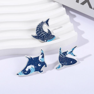 Blue ocean theme enamel pins set featuring starry whale and manta ray designs
