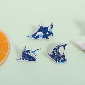 Starry ocean enamel brooch set featuring shark and ray designs with blue glitter finish