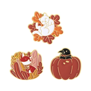 Three-piece autumn enamel pin set with cat, red fox, and crow in pumpkin design