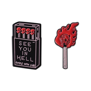 Gothic skull fire matchbox enamel pin set with See You In Hell text handle with care