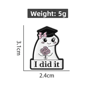 Detailed view of 3.1cm graduation ghost enamel pin with I did it text and size markers