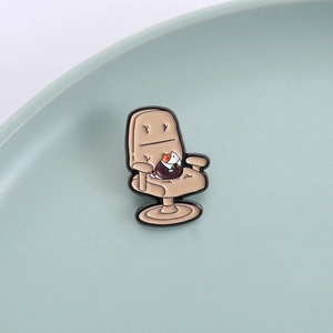 Cartoon office cat enamel pin showing a business cat in suit on an office chair