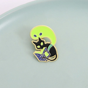 Creative enamel pin featuring a black cat reading a magic book with a green ghost motif