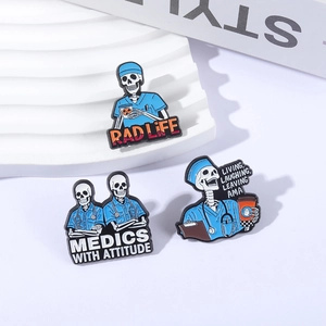Three cartoon skeleton doctor enamel pins on a white display stand for medical professionals
