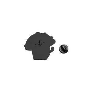 Macro detail of the back of a black enamel pin with a durable rubber clutch fastener