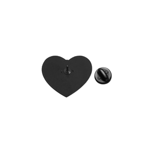 Detail of a black heart-shaped enamel pin back with a rubber clutch on a white background