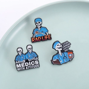 Funny skull medical enamel pins featuring Rad Life and Medics With Attitude slogans