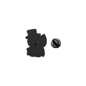 Macro detail of vintage animal brooch back with matte black finish and rubber pin back