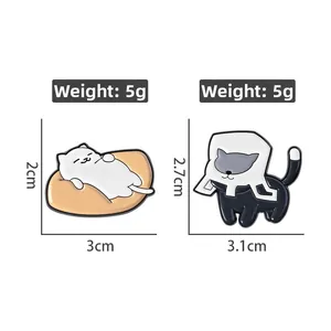 Detail view of cat enamel pins with dimensions and 5g weight on white background