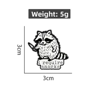 Funny enamel raccoon pin with 'i require snacks' slogan and 3cm size measurements