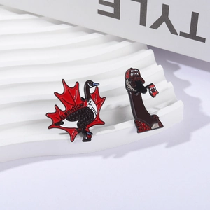 Creative enamel goose brooches featuring maple leaf and Canadian flag designs