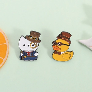 Steampunk cat and duck enamel pins set with gear hats and goggles on mint green background