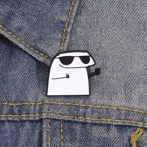 Funny cartoon Flork brooch wearing sunglasses with peace sign on denim jacket