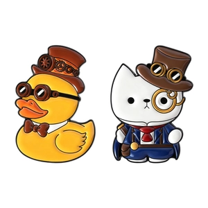 Steampunk enamel brooches featuring vintage yellow duck and white cat in top hats
