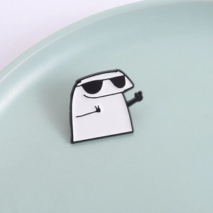 Funny Flork meme enamel pin with sunglasses and peace signs on a green ceramic plate