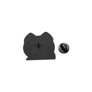 Detail view of the black metal back with butterfly clutch on a cartoon cat brooch