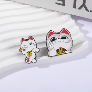 Cute red and white lucky cat enamel pins with cheerful and quirky expressions
